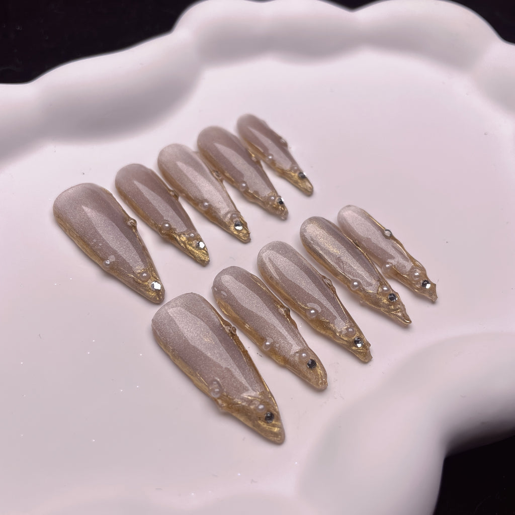 Set of 10 Handmade Press-On Nails Stiletto Shape in Champagne And Golden French Styles, Adorned with Luxurious Crystals And Shiny Pearls