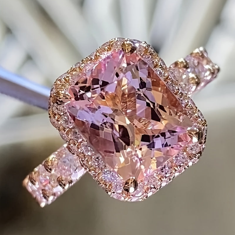 Elegant Pink Synthetic Zirconia Ring with Halo Setting & Rose Golden Plating