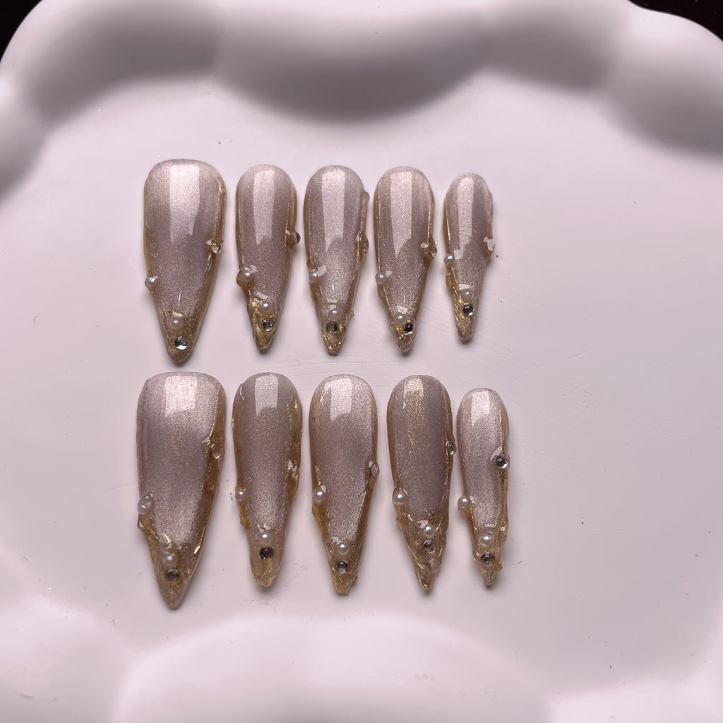Set of 10 Handmade Press-On Nails Stiletto Shape in Champagne And Golden French Styles, Adorned with Luxurious Crystals And Shiny Pearls