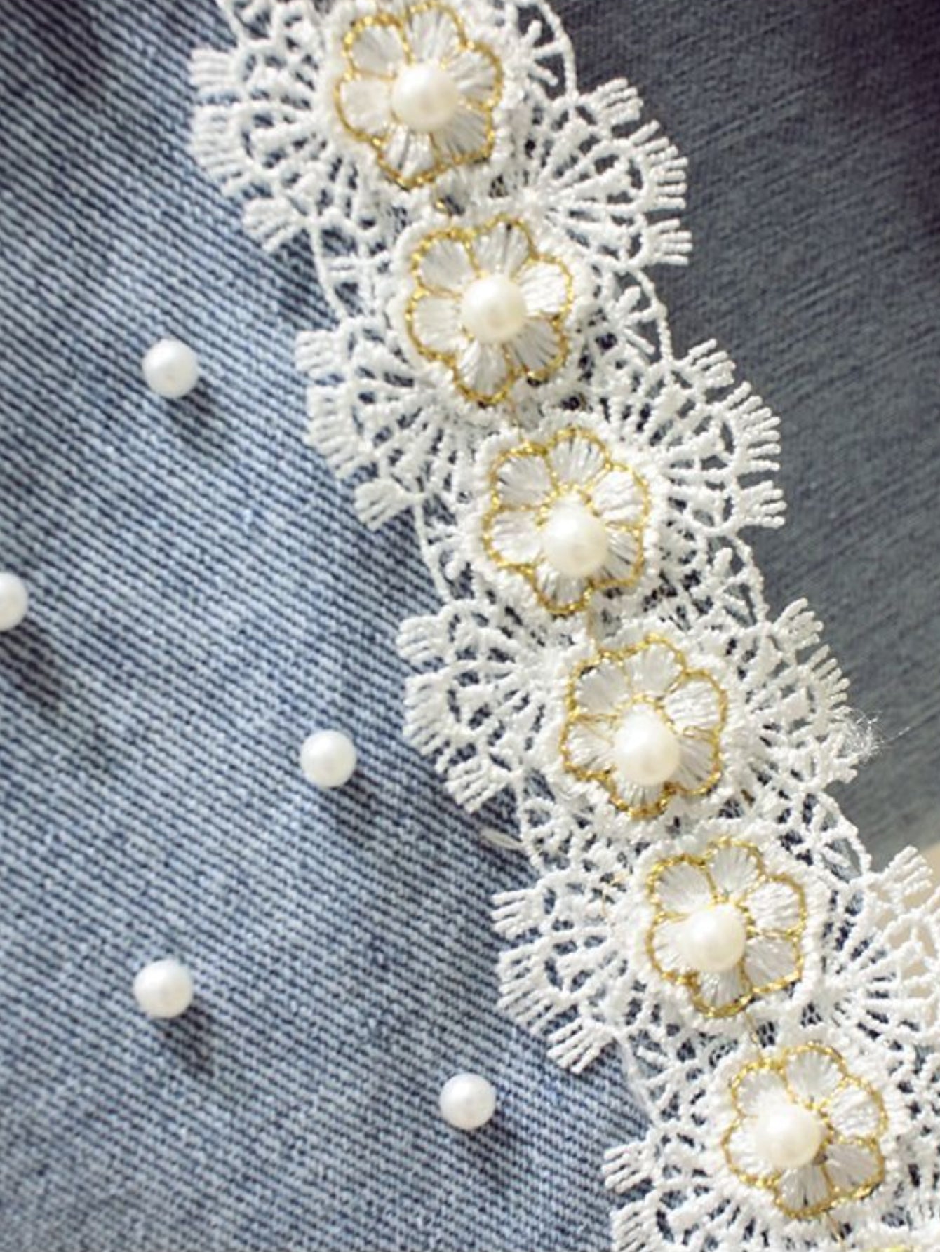 High-Waisted Slim-Fit Denim Skirt with Pearl-Trimmed Slit & Fringe Hem