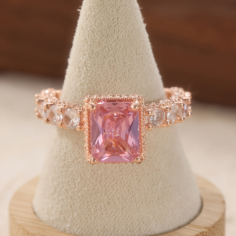 Elegant Pink Synthetic Zirconia Ring with Halo Setting & Rose Golden Plating