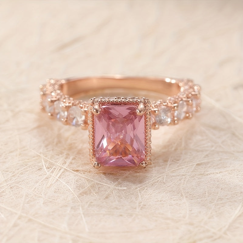 Elegant Pink Synthetic Zirconia Ring with Halo Setting & Rose Golden Plating