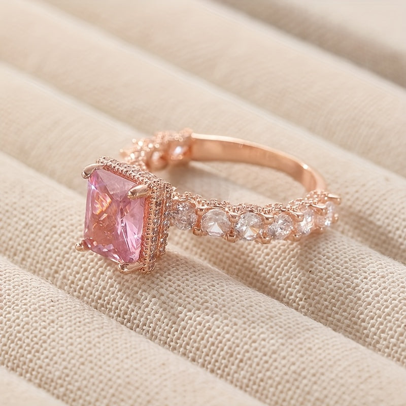 Elegant Pink Synthetic Zirconia Ring with Halo Setting & Rose Golden Plating