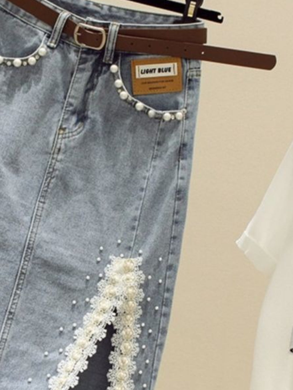 High-Waisted Slim-Fit Denim Skirt with Pearl-Trimmed Slit & Fringe Hem