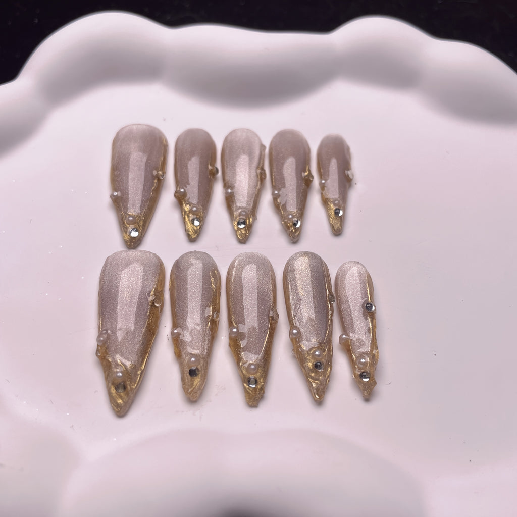 Set of 10 Handmade Press-On Nails Stiletto Shape in Champagne And Golden French Styles, Adorned with Luxurious Crystals And Shiny Pearls